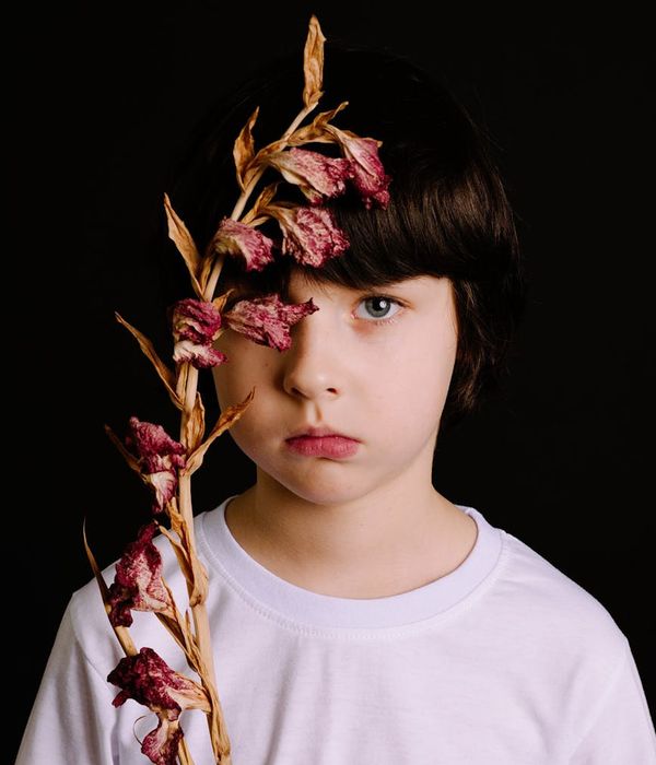 Person in a balanced pose against a calm, dark background.